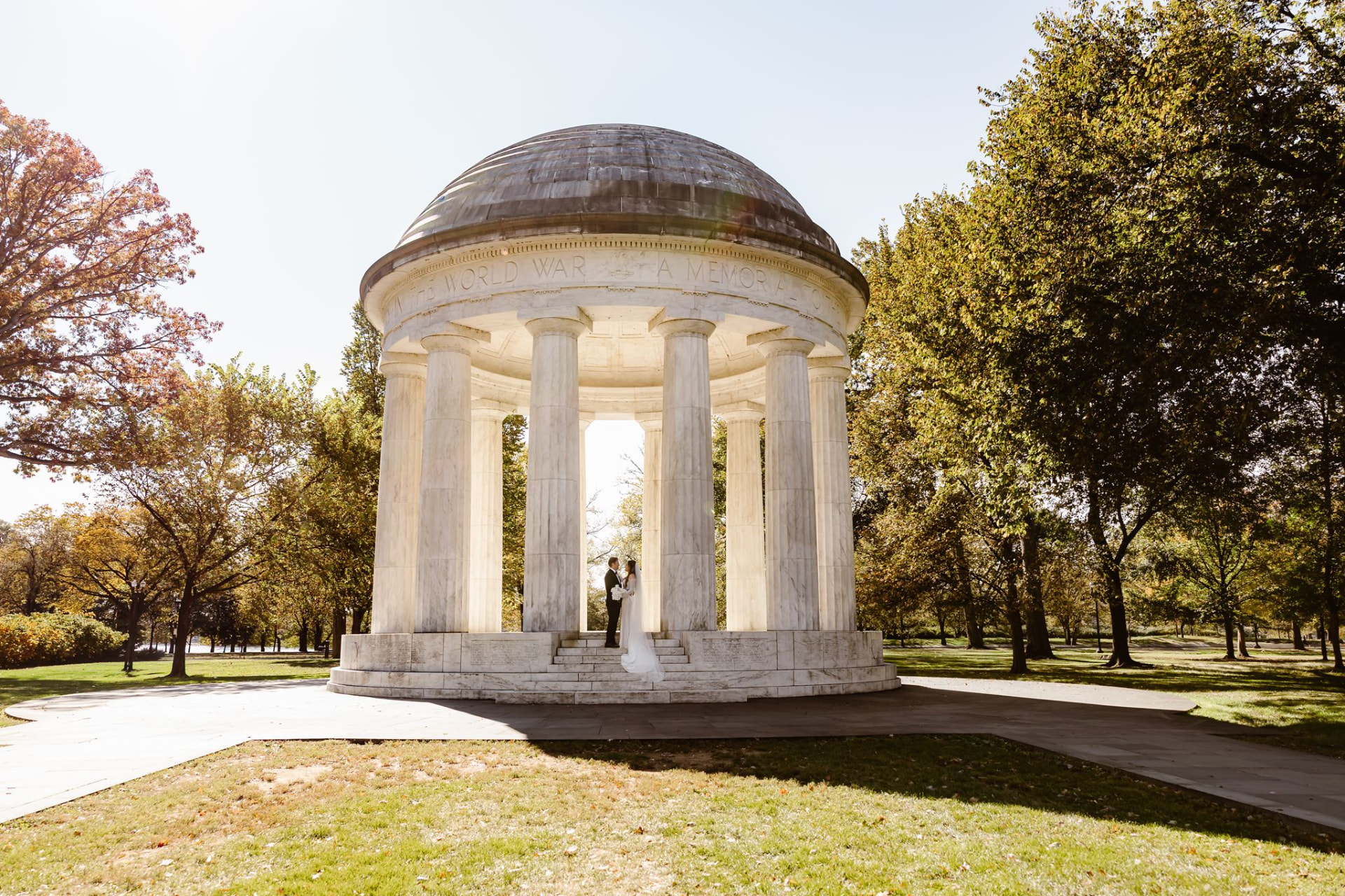 Couple exchanging vows beneath the marble rotunda